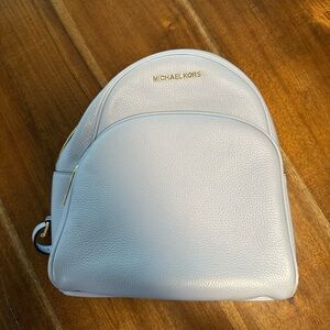 Light blue Michael kors backpack.